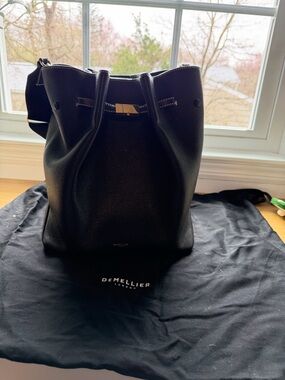 DeMellier Black Large Leather Bucket Bag with Gold Hardware and Crossbody Strap.